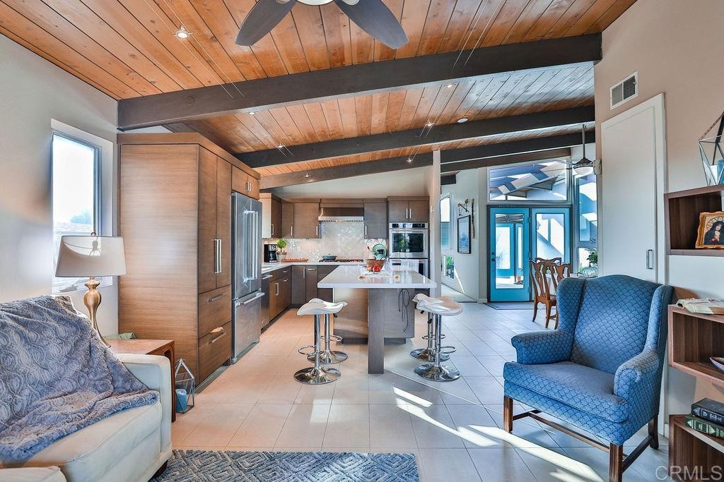 3573 Chasewood Drive San Diego, CA 92111 - Photo 13 of 57 a living room with furniture and a flat screen tv