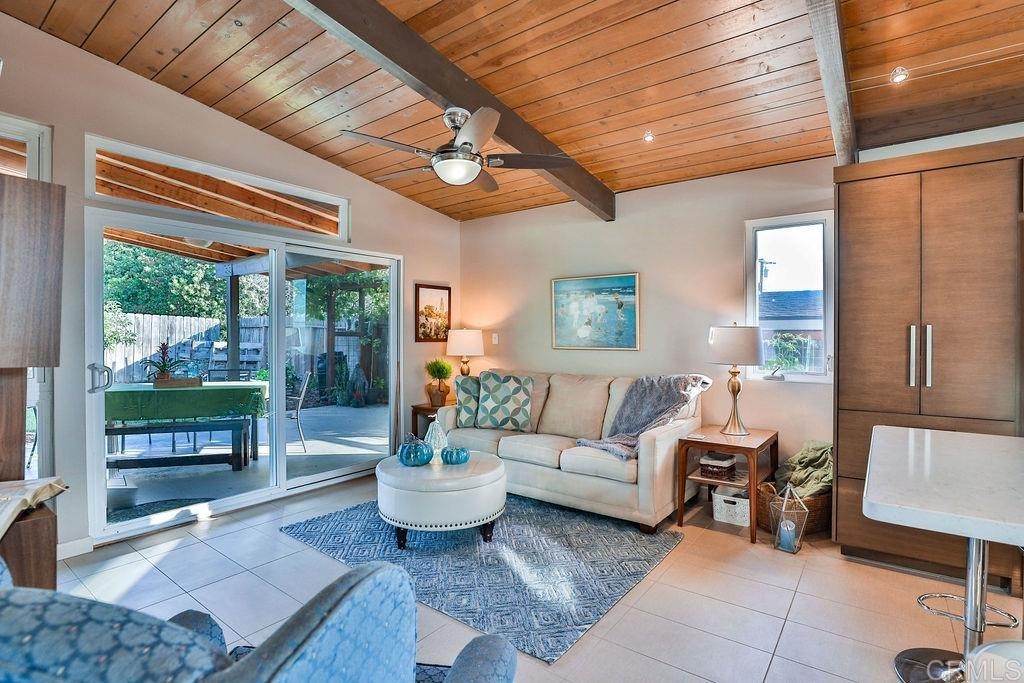 3573 Chasewood Drive San Diego, CA 92111 - Photo 14 of 57 a living room with furniture and a potted plant