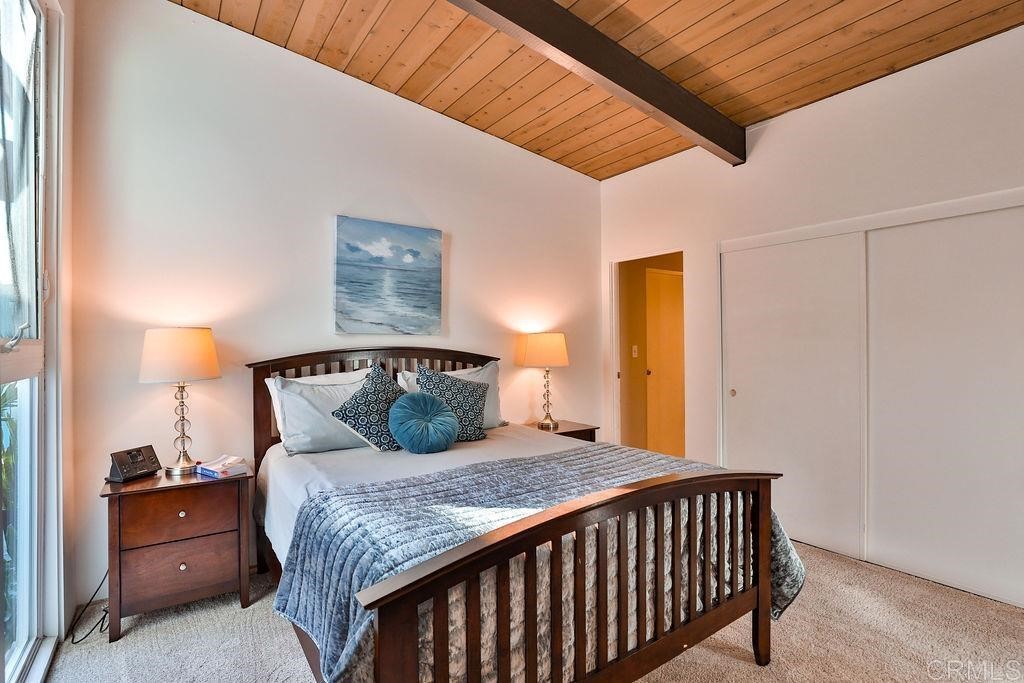 3573 Chasewood Drive San Diego, CA 92111 - Photo 19 of 57 a bedroom with a bed and wooden floor