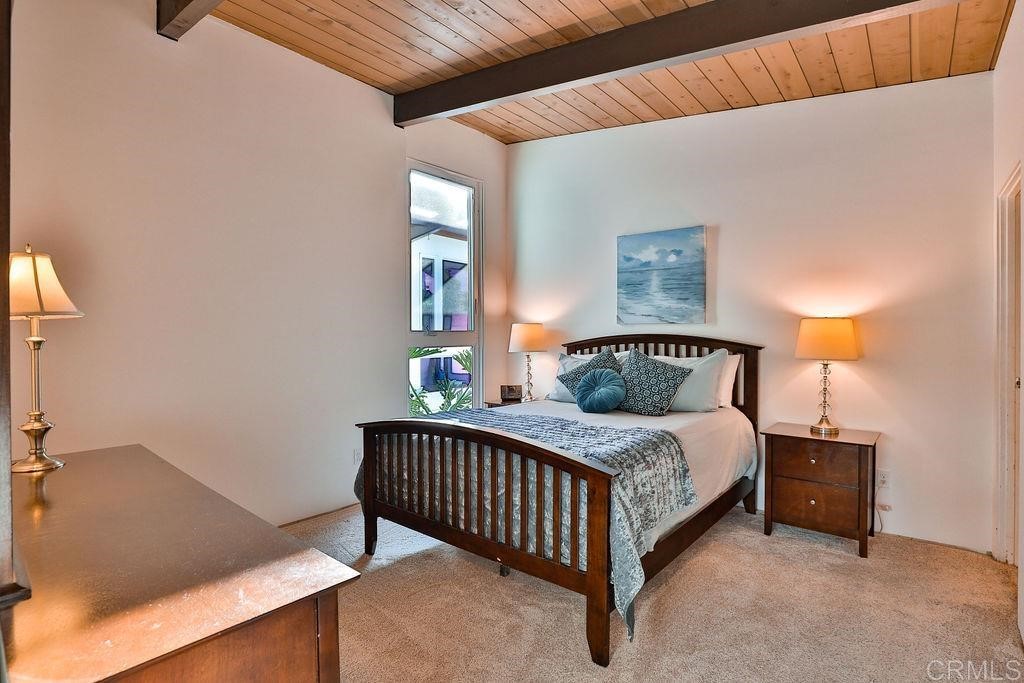 3573 Chasewood Drive San Diego, CA 92111 - Photo 20 of 57 a bedroom with a bed and window