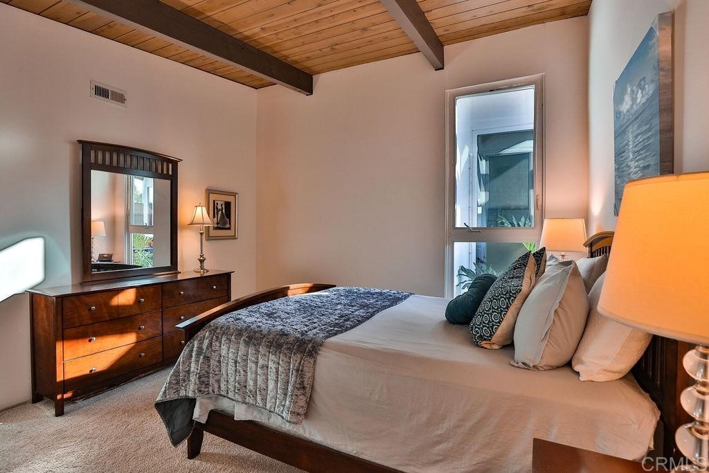 3573 Chasewood Drive San Diego, CA 92111 - Photo 22 of 57 a bedroom with a bed and window