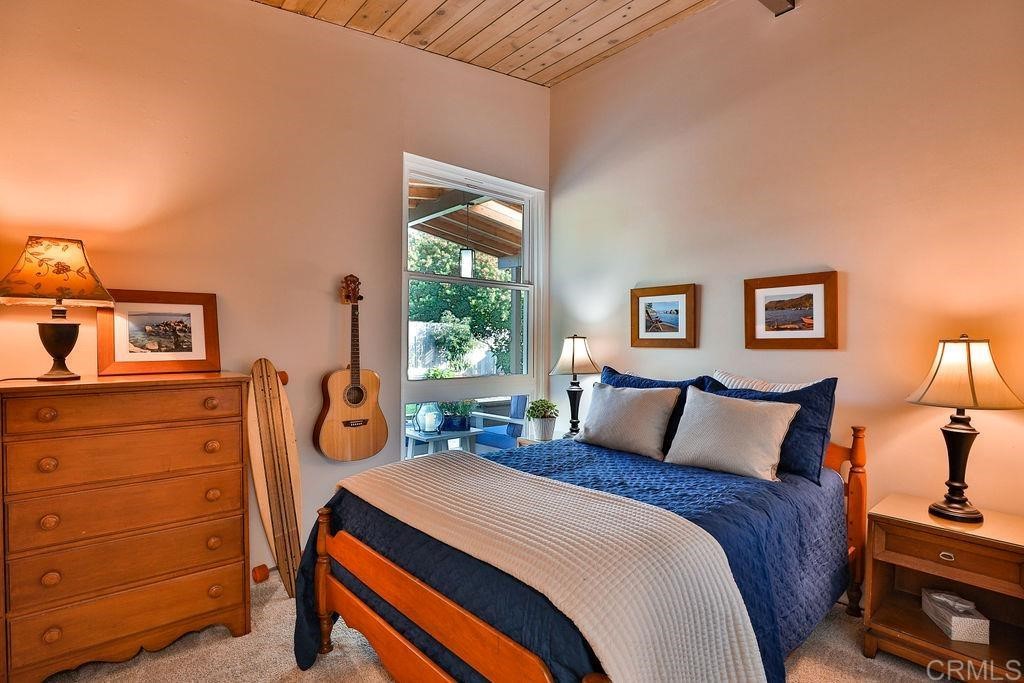 3573 Chasewood Drive San Diego, CA 92111 - Photo 23 of 57 a bedroom with a bed and a dresser