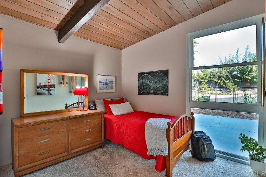 3573 Chasewood Drive San Diego, CA 92111 - Photo 24 of 57 a bedroom with a bed and window