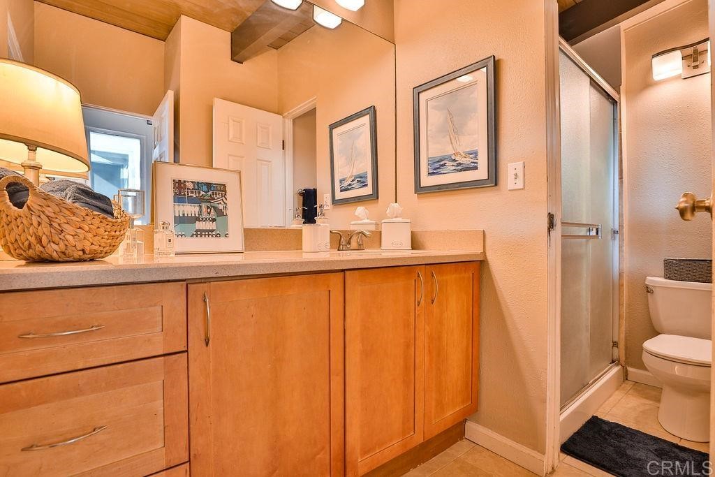 3573 Chasewood Drive San Diego, CA 92111 - Photo 28 of 57 a bathroom with a sink and a mirror