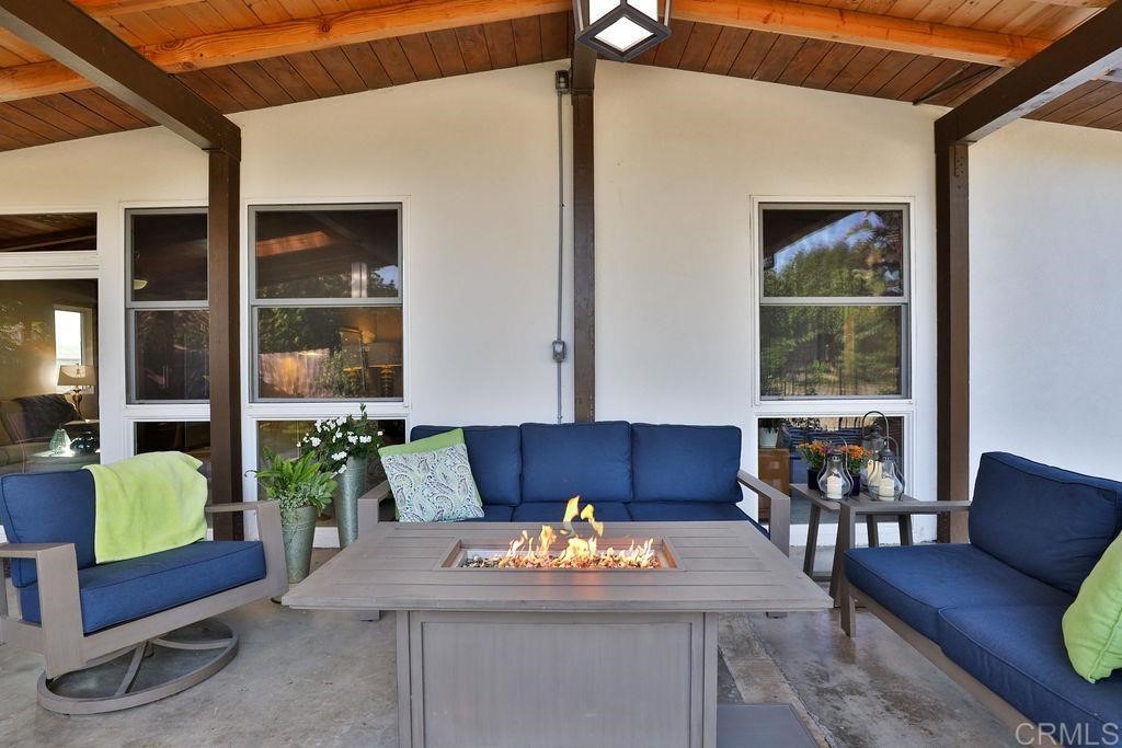3573 Chasewood Drive San Diego, CA 92111 - Photo 30 of 57 a living room with furniture and a large window