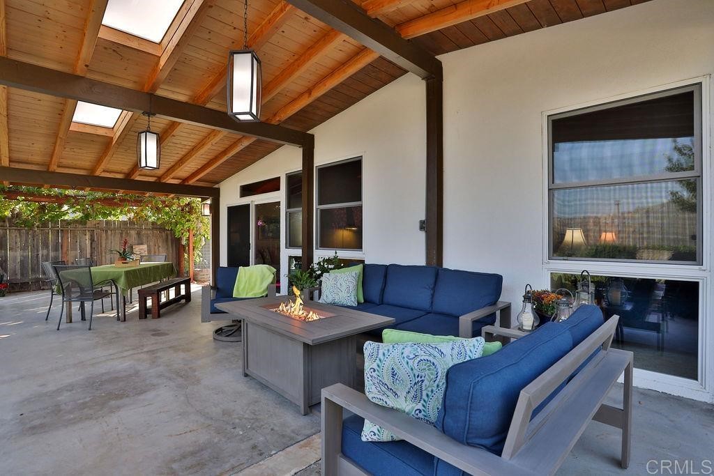 3573 Chasewood Drive San Diego, CA 92111 - Photo 32 of 57 a outdoor living space with patio furniture and a fireplace