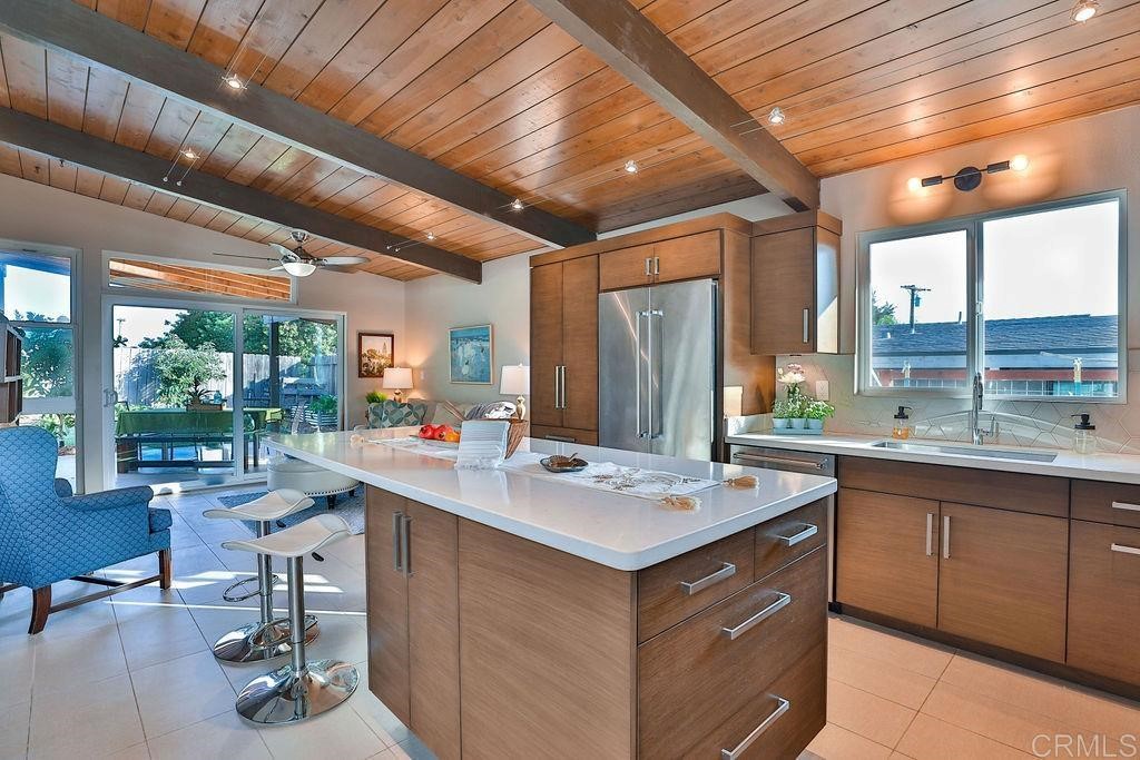 3573 Chasewood Drive San Diego, CA 92111 - Photo 4 of 57 a room with a sink a window and chairs