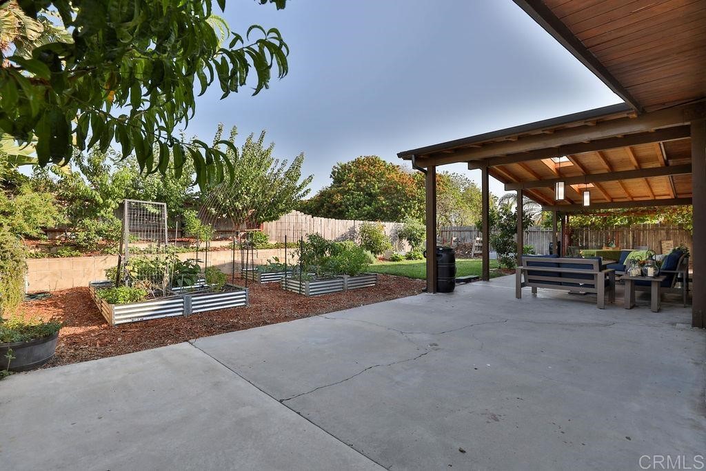 3573 Chasewood Drive San Diego, CA 92111 - Photo 43 of 57 a view of a patio with table and chairs and potted plants