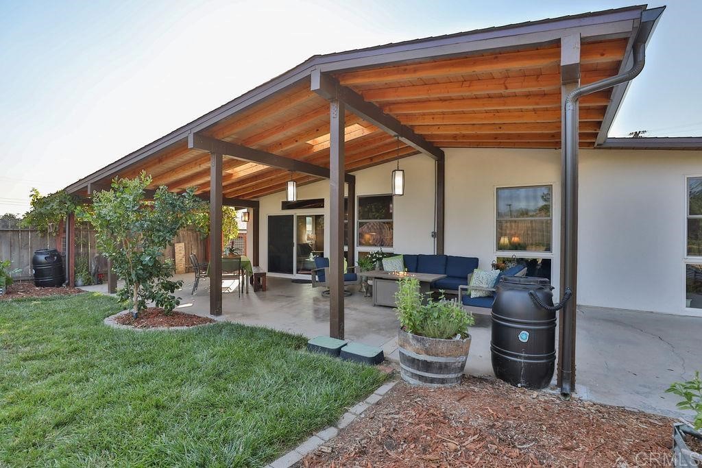 3573 Chasewood Drive San Diego, CA 92111 - Photo 48 of 57 a view of a backyard with table and chairs potted plants and a chair