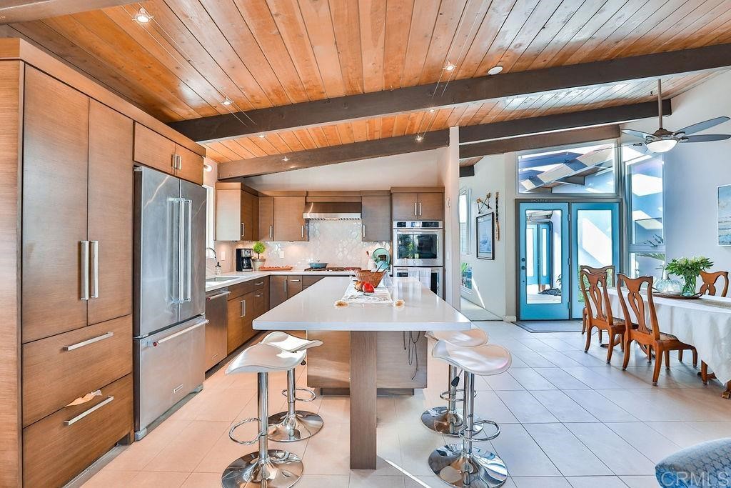 3573 Chasewood Drive San Diego, CA 92111 - Photo 9 of 57 a large kitchen with a table and chairs