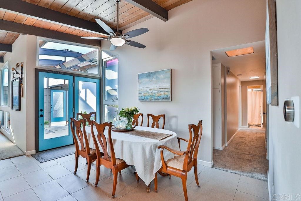 3573 Chasewood Drive San Diego, CA 92111 - Photo 10 of 57 a dining room with furniture and a chandelier