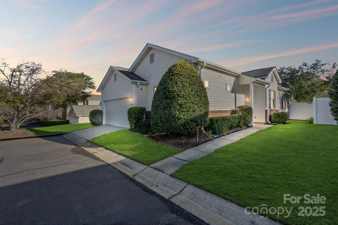 8663 Meadowmont View Drive Charlotte, NC 28269 - Photo 1 of 30 a front view of a house with garden