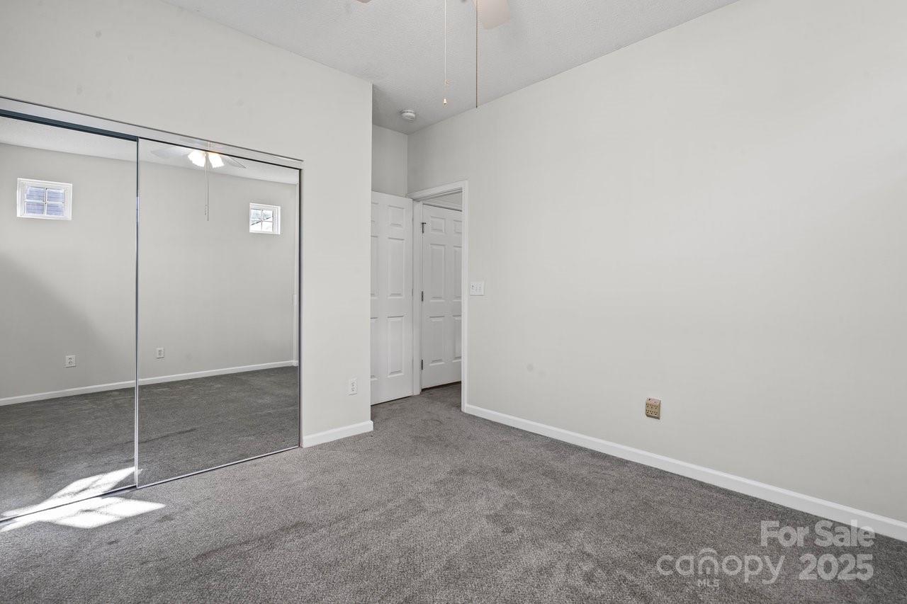 8663 Meadowmont View Drive Charlotte, NC 28269 - Photo 18 of 30 a view of a room with a shower and closet