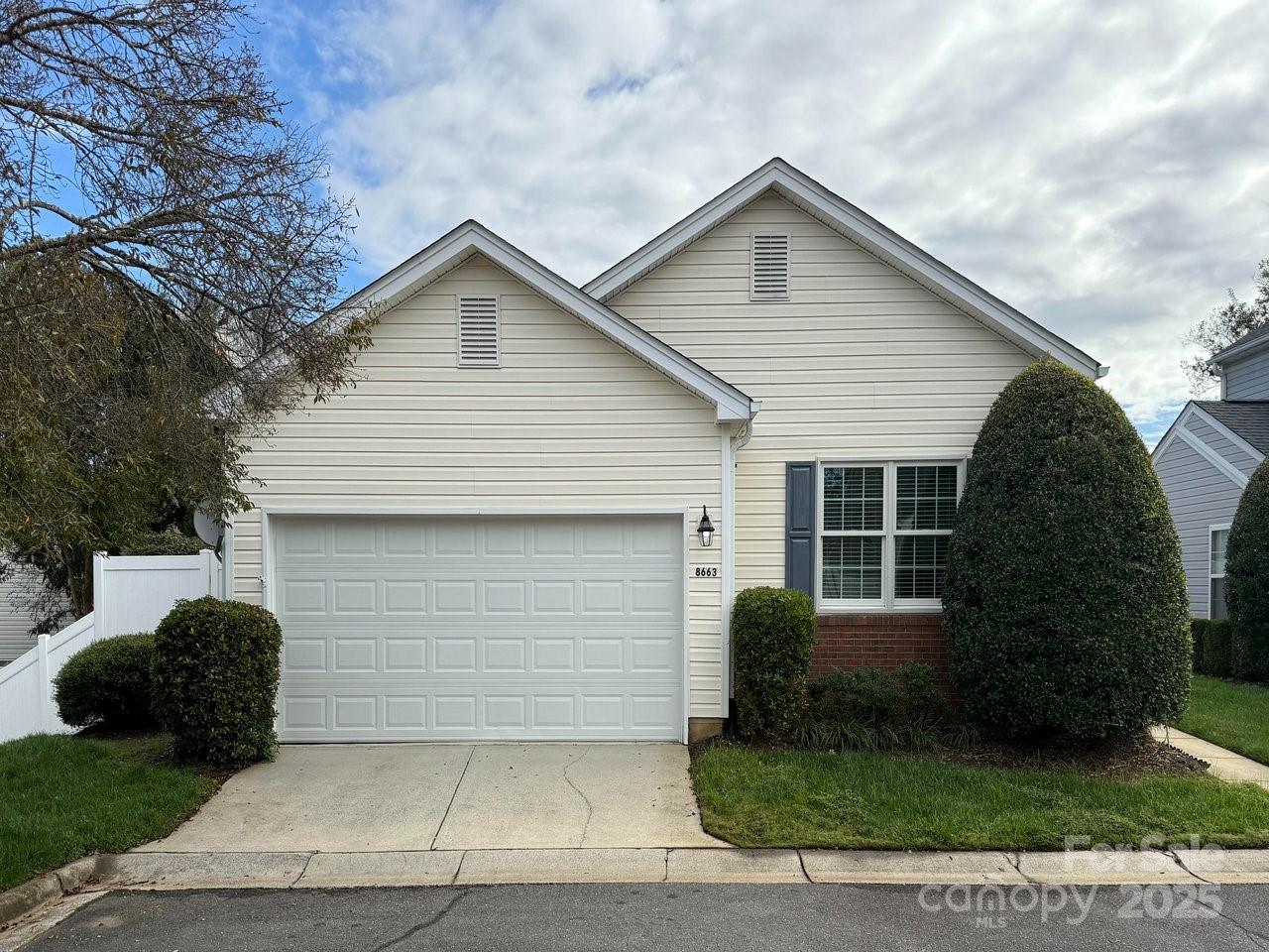 8663 Meadowmont View Drive Charlotte, NC 28269 - Photo 2 of 30 a front view of house with yard and trees around