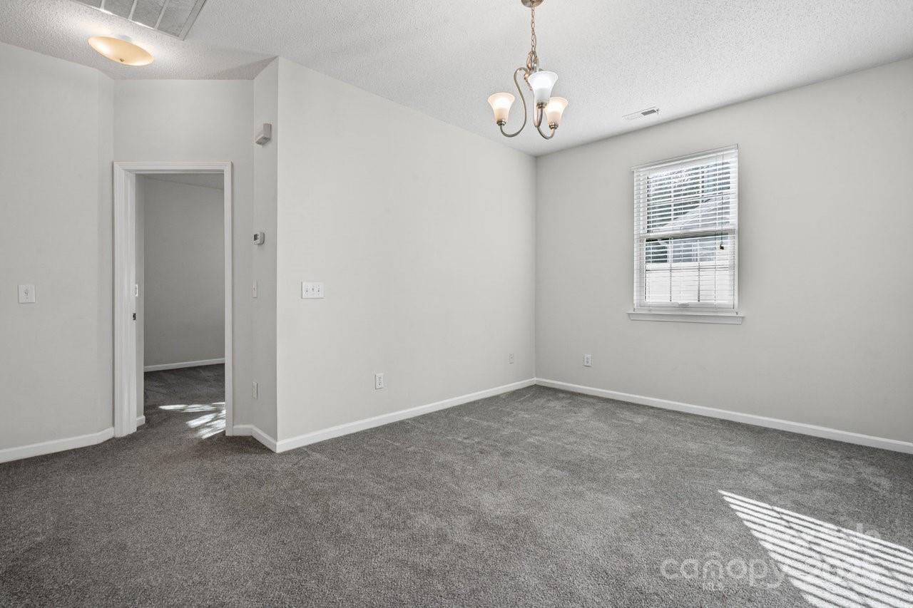 8663 Meadowmont View Drive Charlotte, NC 28269 - Photo 23 of 30 a view of an empty room with a window