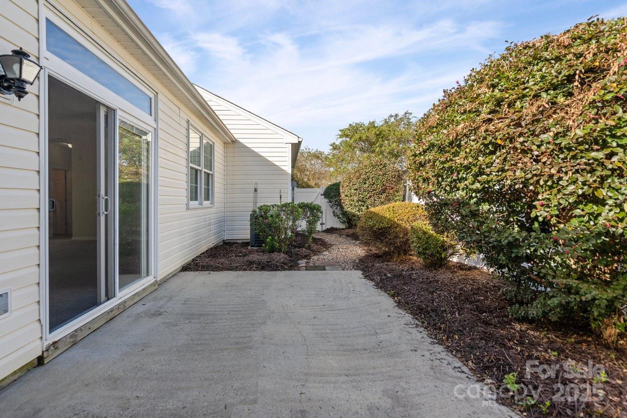 8663 Meadowmont View Drive Charlotte, NC 28269 - Photo 24 of 30 a view of a house with a backyard