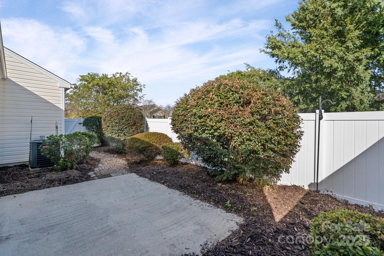 8663 Meadowmont View Drive Charlotte, NC 28269 - Photo 25 of 30 a pathway with a house
