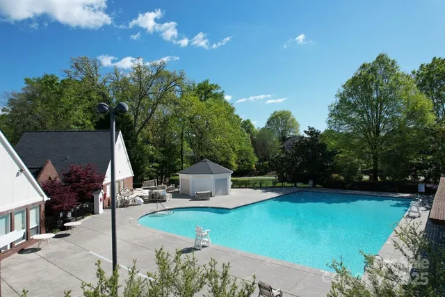 a view of a house with backyard and a patio
