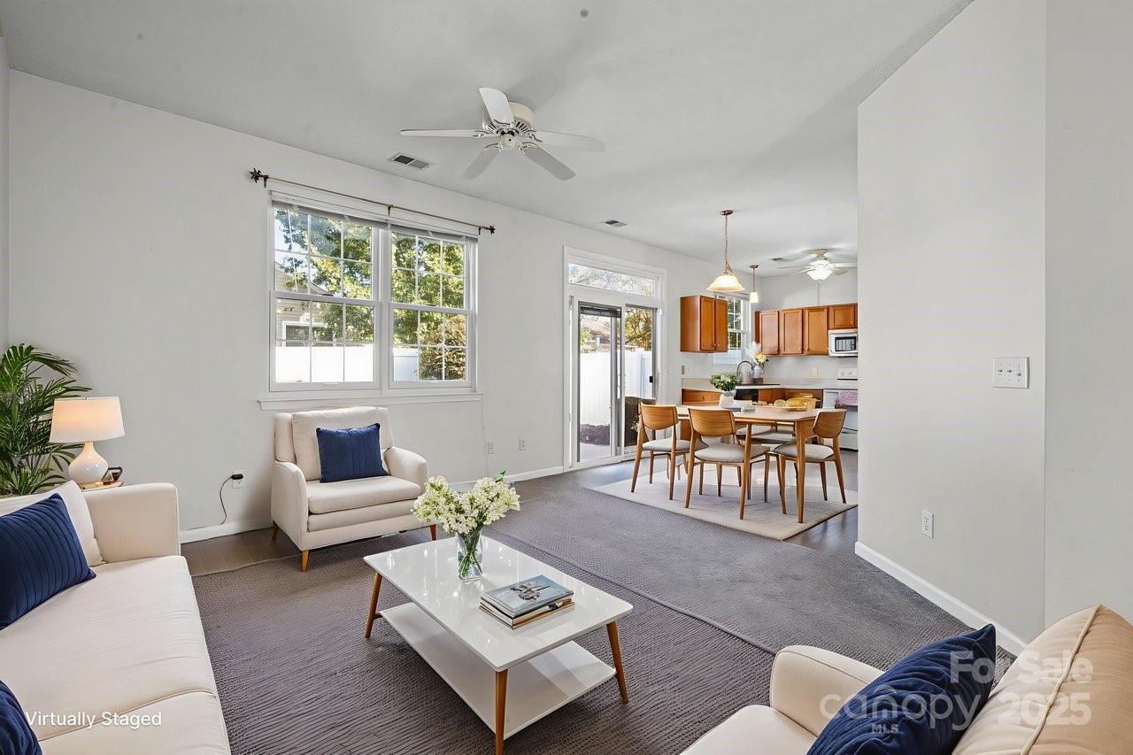 8663 Meadowmont View Drive Charlotte, NC 28269 - Photo 8 of 30 a living room with furniture and a large window