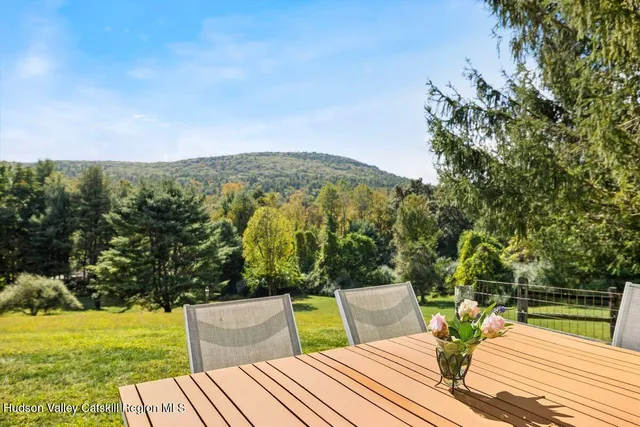 a living room with furniture and a book shelf