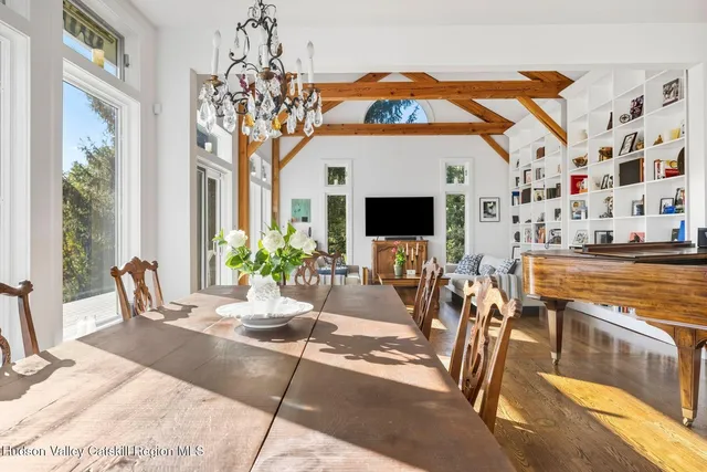 a hallway with cabinets and wooden floor