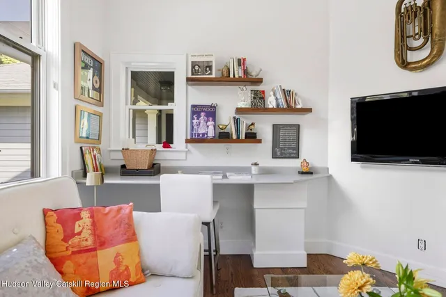 a bathroom with a toilet a sink and a mirror