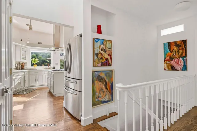 a aerial view of a house with swimming pool next to a yard