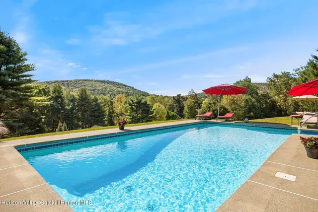 a front view of a house with large windows