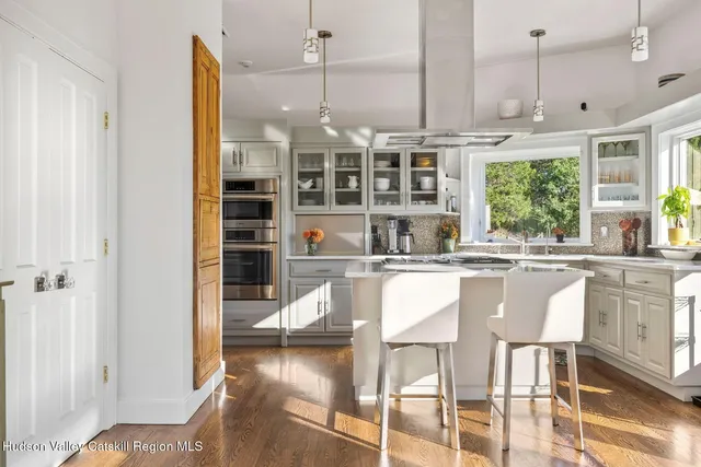 a kitchen with stainless steel appliances granite countertop a stove and a refrigerator