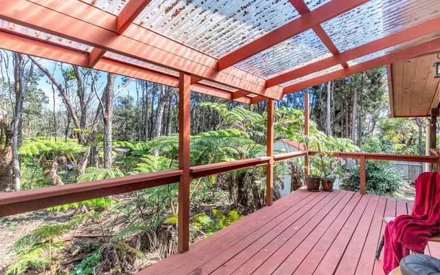 a view of balcony with wooden floor