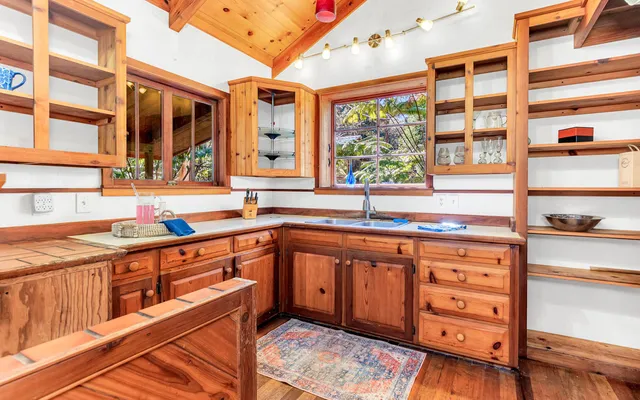 a kitchen with stainless steel appliances granite countertop a stove and a sink