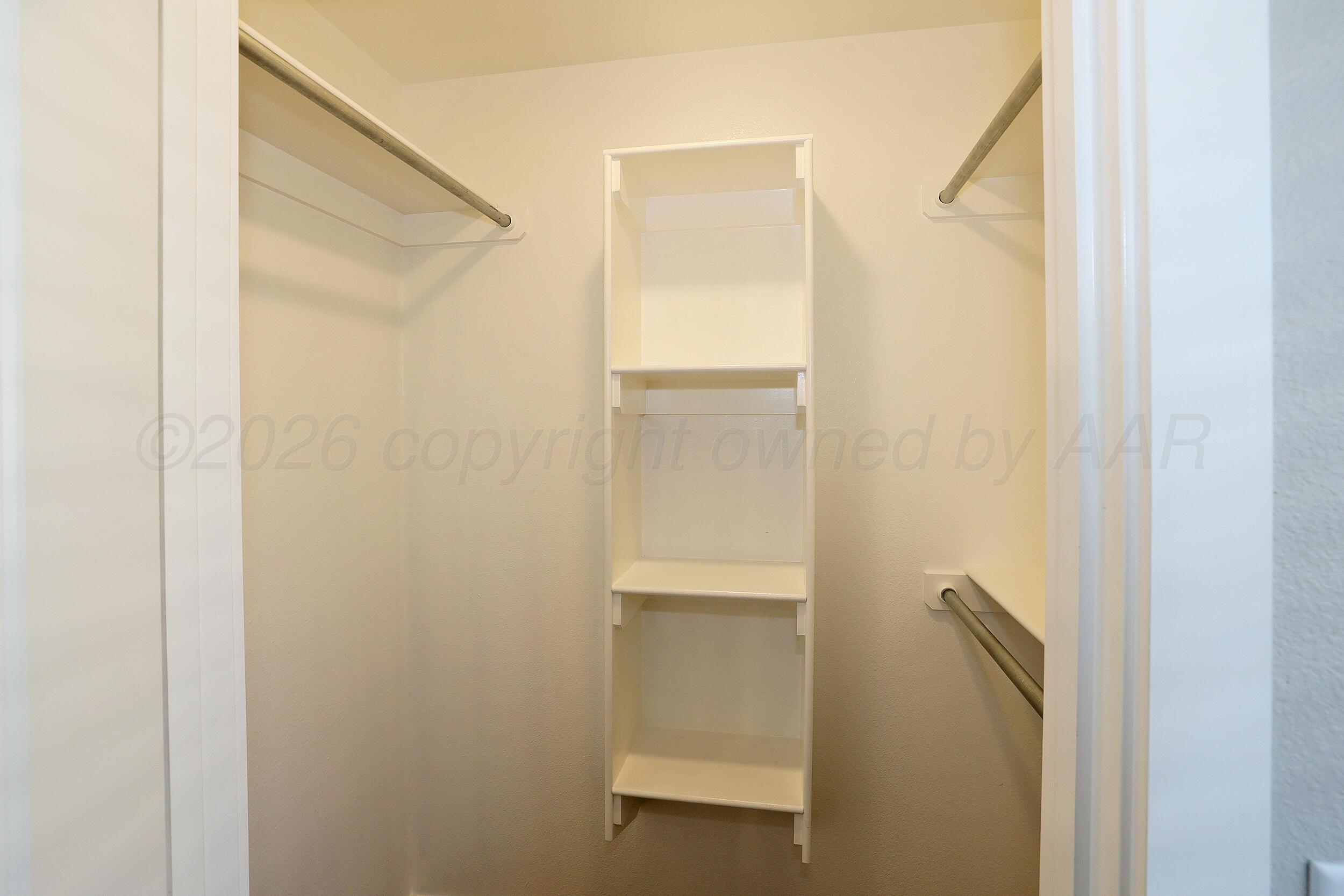 7205 Athens Street Amarillo, TX 79118 - Photo 16 of 25 a bathroom with a glass shower door