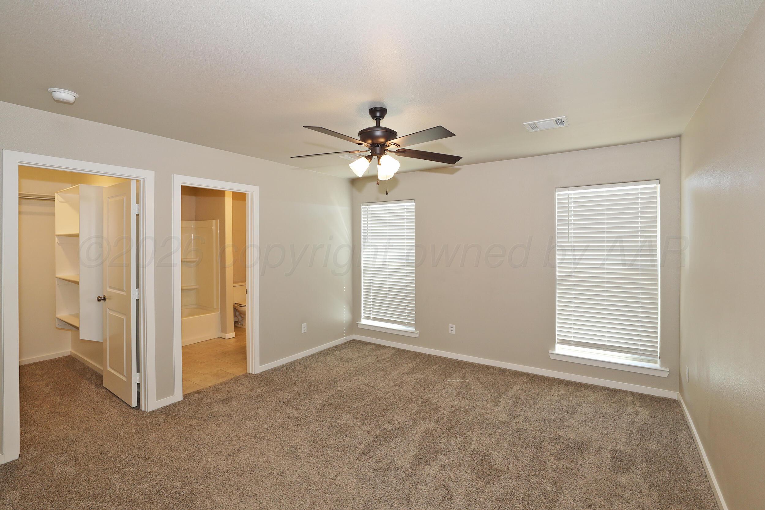7205 Athens Street Amarillo, TX 79118 - Photo 22 of 25 a view of an empty room with a window