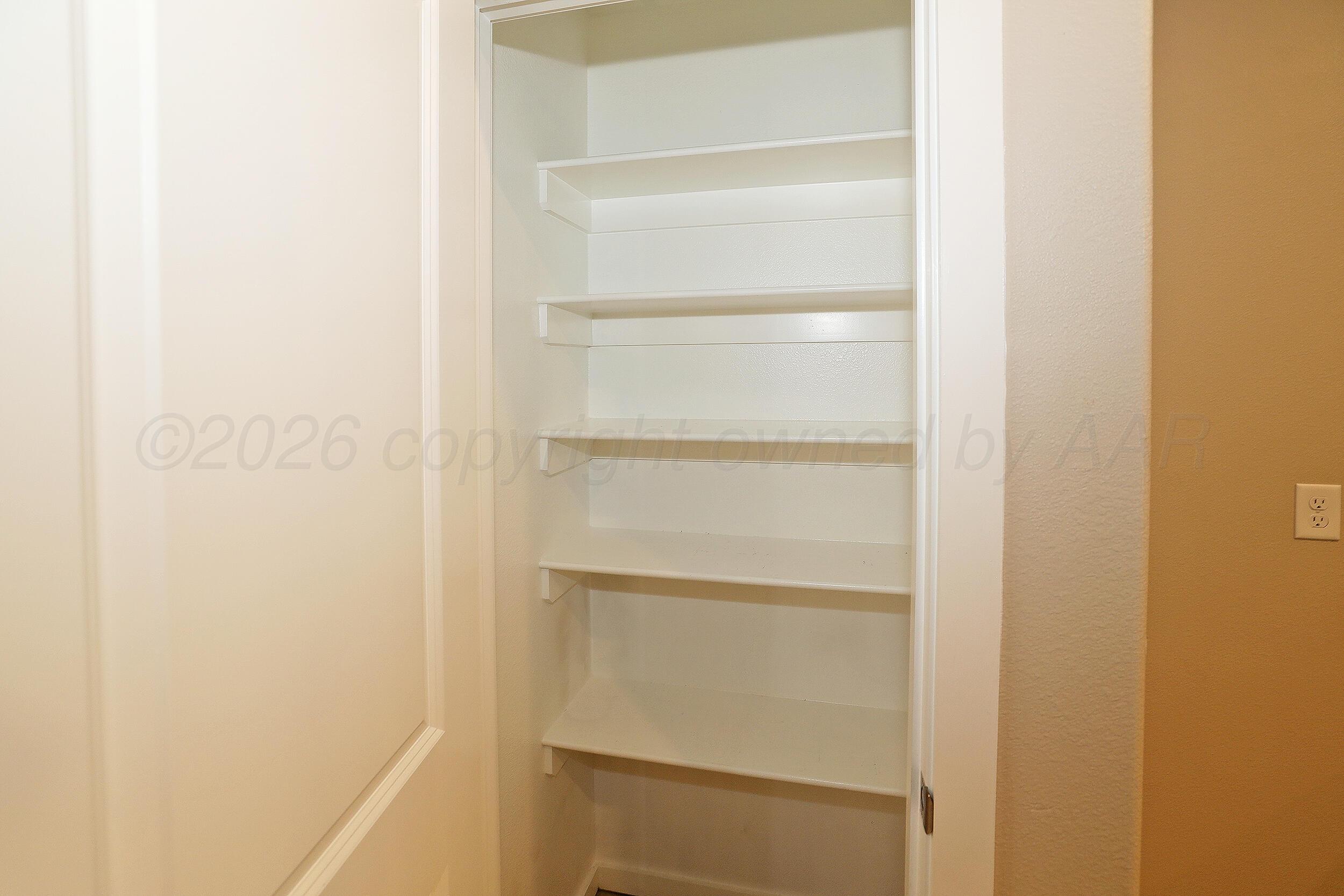 7205 Athens Street Amarillo, TX 79118 - Photo 9 of 25 a empty closet with white paint