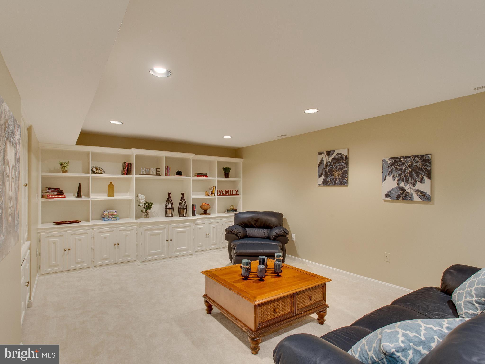 6565 Forsythia Street Springfield, VA 22150 - Photo 23 of 30 Enormous Recreation Room with Built In Shelving