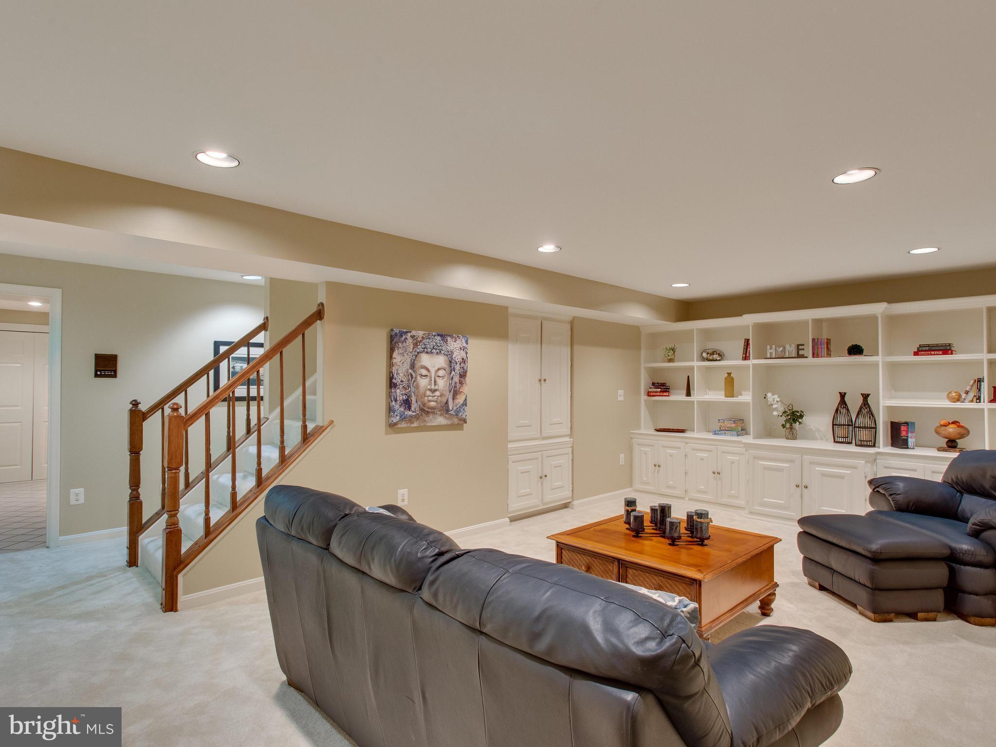 6565 Forsythia Street Springfield, VA 22150 - Photo 24 of 30 Enormous Recreation Room with Built In Shelving
