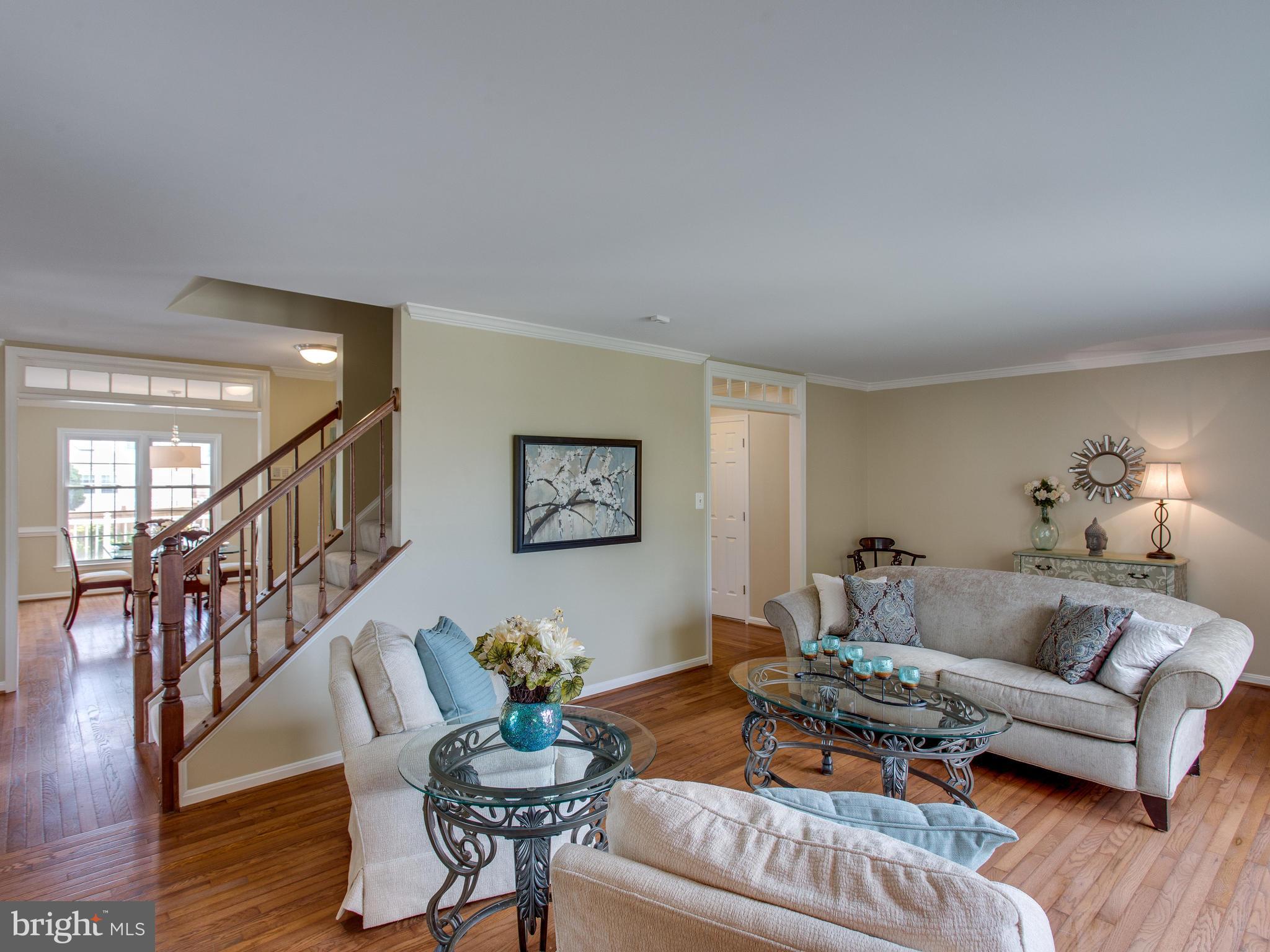 6565 Forsythia Street Springfield, VA 22150 - Photo 6 of 30 Wood Floors Adorning the Living Room