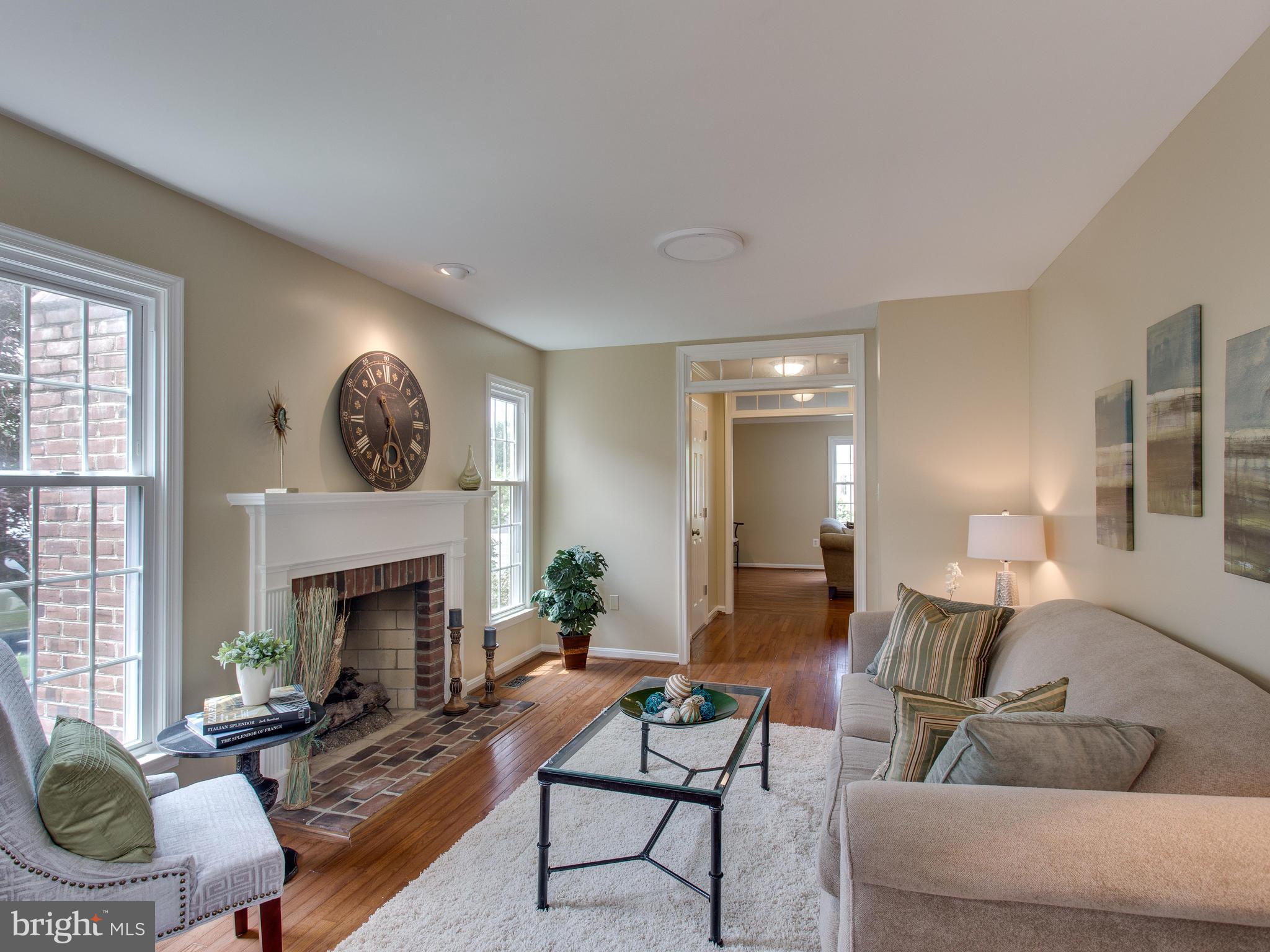 6565 Forsythia Street Springfield, VA 22150 - Photo 9 of 30 Gas Fireplace Adorning the Family Room