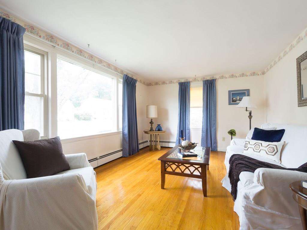 91 Carlyle Road Portland, ME 04103 - Photo 11 of 27 The living room features a striking...