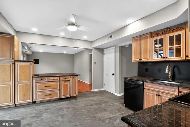 a kitchen with stainless steel appliances granite countertop a stove and a refrigerator