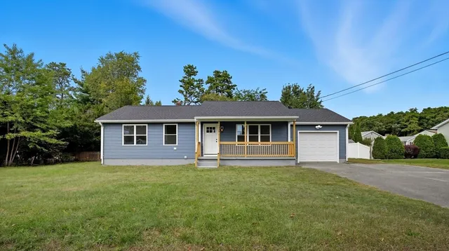 front view of a house with a yard