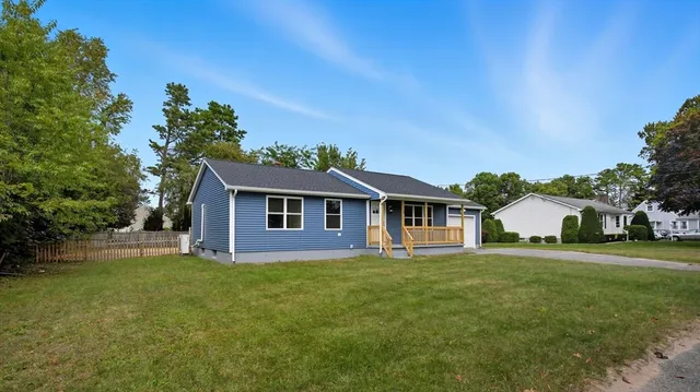 front view of a house with a yard