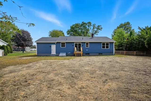a view of a house with backyard porch and garden
