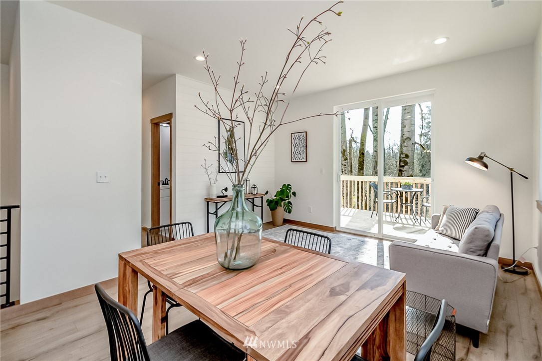2624 Callow Road, Unit B Lake Stevens, WA 98258 - Photo 19 of 37 a view of a dining room with furniture window and wooden floor