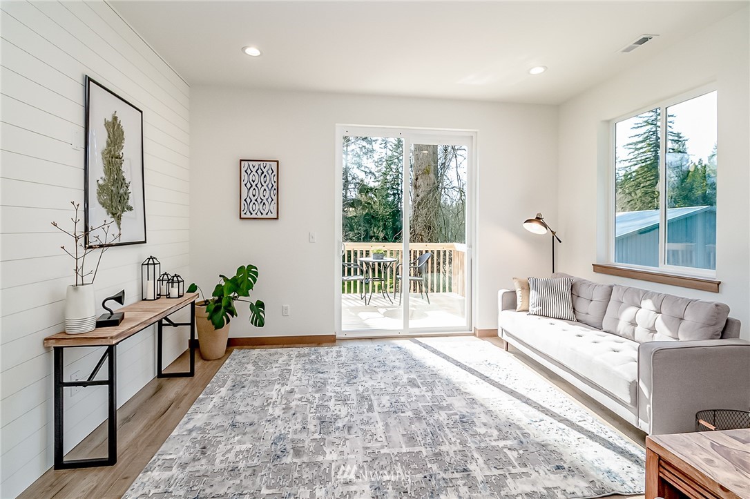 2624 Callow Road, Unit B Lake Stevens, WA 98258 - Photo 20 of 37 a living room with furniture and a large window