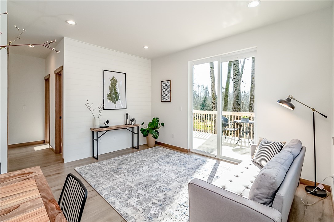 2624 Callow Road, Unit B Lake Stevens, WA 98258 - Photo 21 of 37 a living room with furniture and a large window