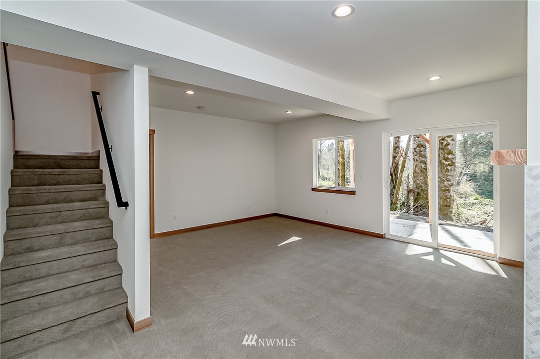 2624 Callow Road, Unit B Lake Stevens, WA 98258 - Photo 30 of 37 a view of an empty room with stairs and a window