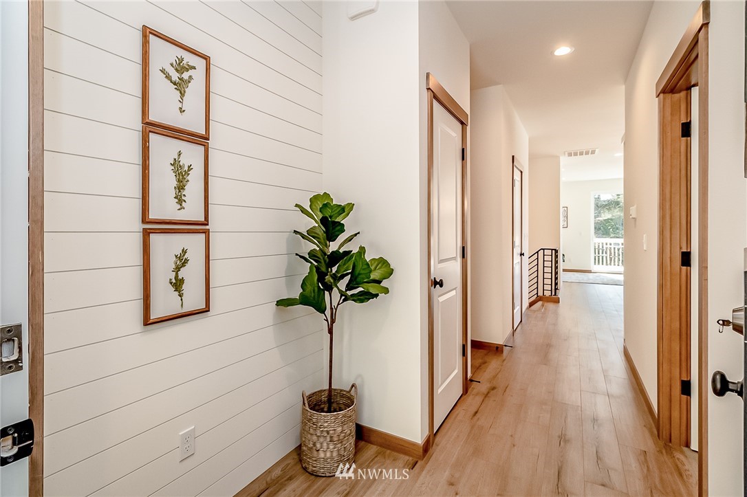 2624 Callow Road, Unit B Lake Stevens, WA 98258 - Photo 4 of 37 a view of a hallway with wooden floor and front door