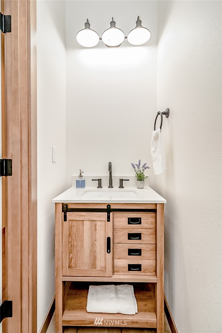 2624 Callow Road, Unit B Lake Stevens, WA 98258 - Photo 5 of 37 a bathroom with a sink and a mirror