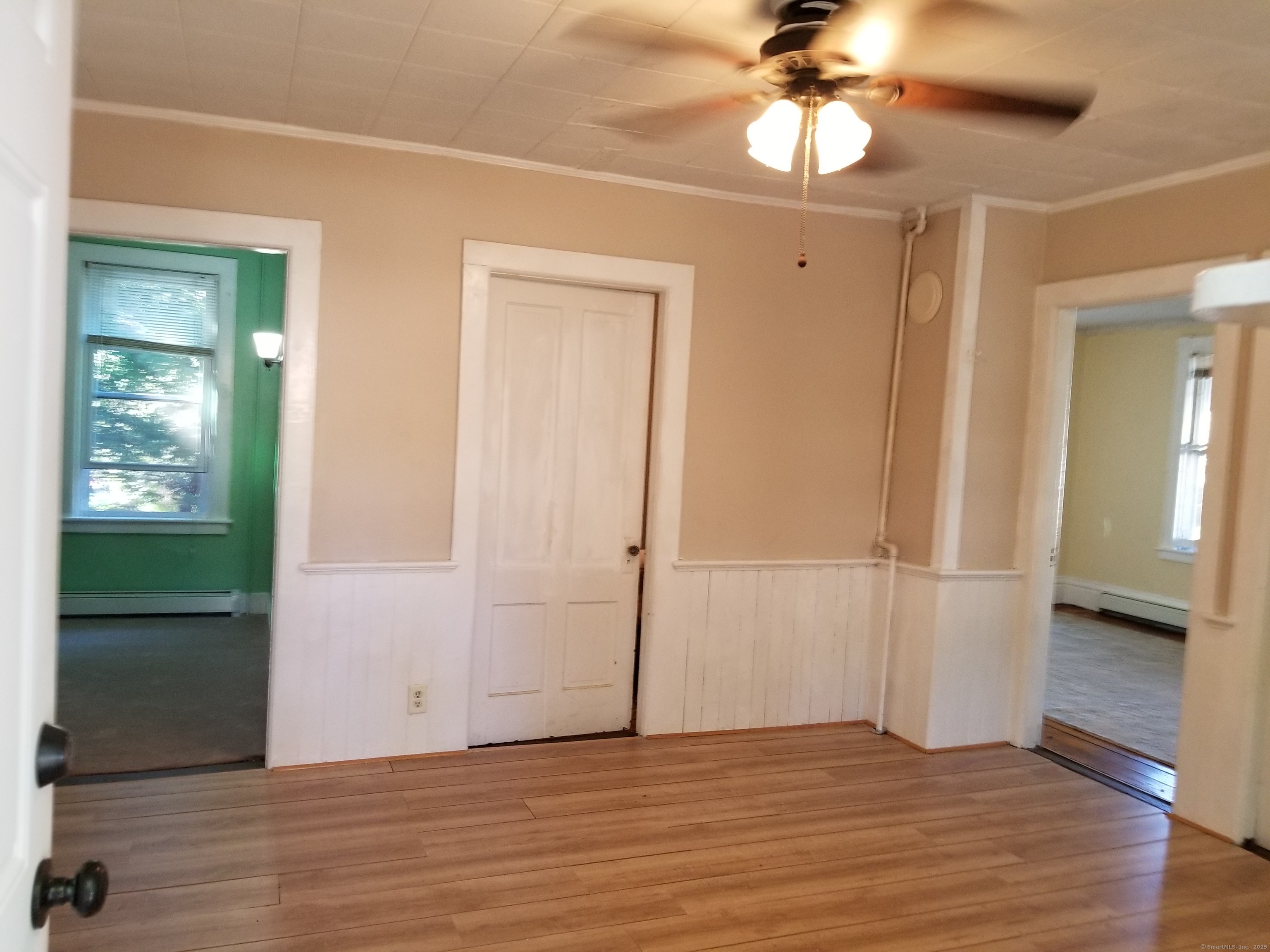 120 Liberty Street Stonington, CT 06379 - Photo 2 of 6 wooden floor in an empty room with a window